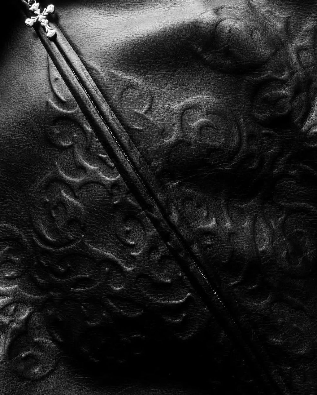 monochrome darkwear outfit featuring a statement embossed leather bomber jacket