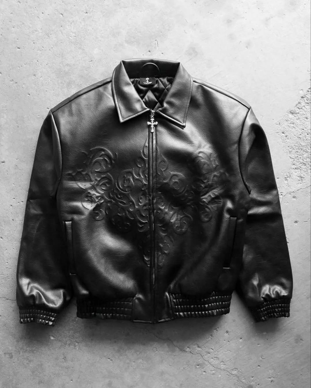 monochrome darkwear outfit featuring a statement embossed leather bomber jacket