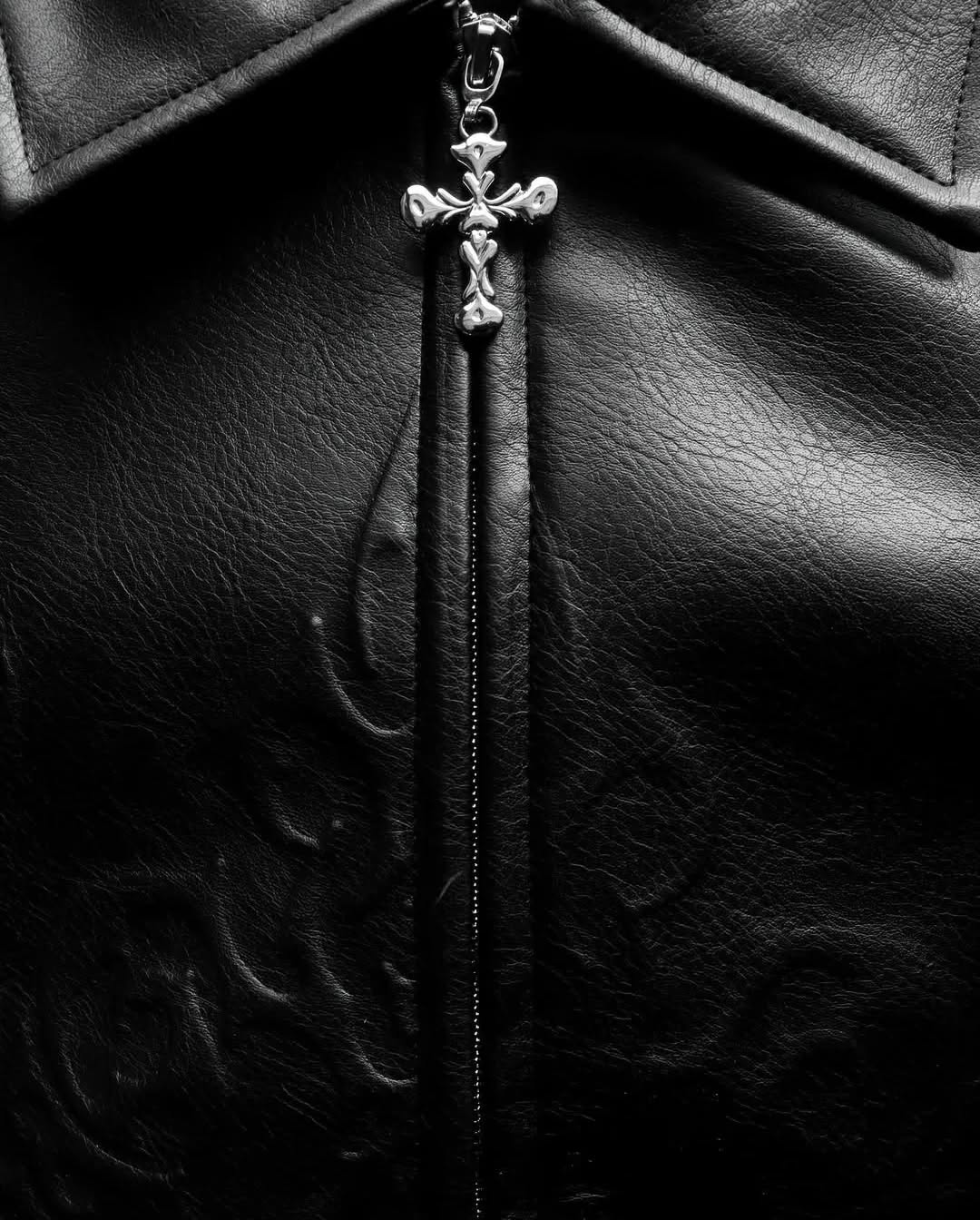 monochrome darkwear outfit featuring a statement embossed leather bomber jacket