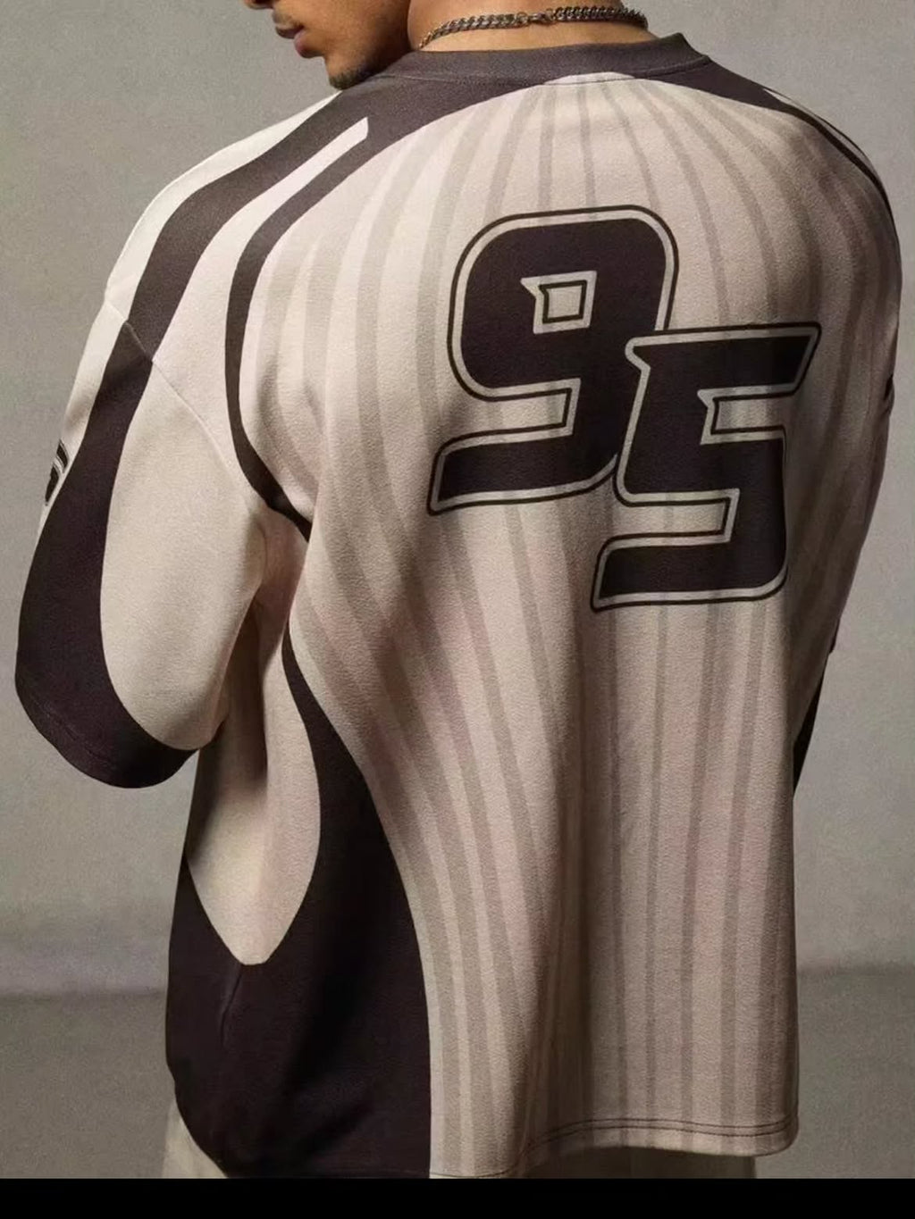 short-sleeved sports jersey or athletic t-shirt featuring a retro/motocross vibe