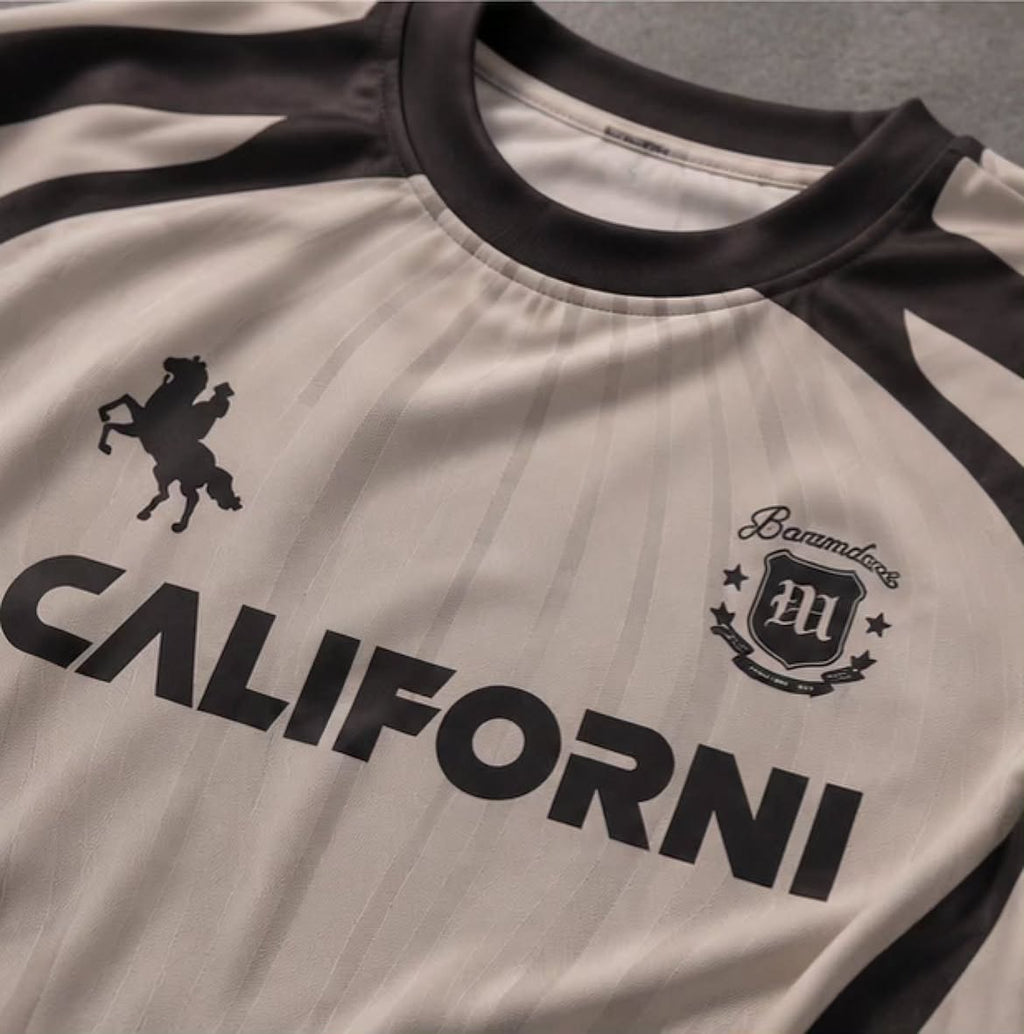 short-sleeved sports jersey or athletic t-shirt featuring a retro/motocross vibe