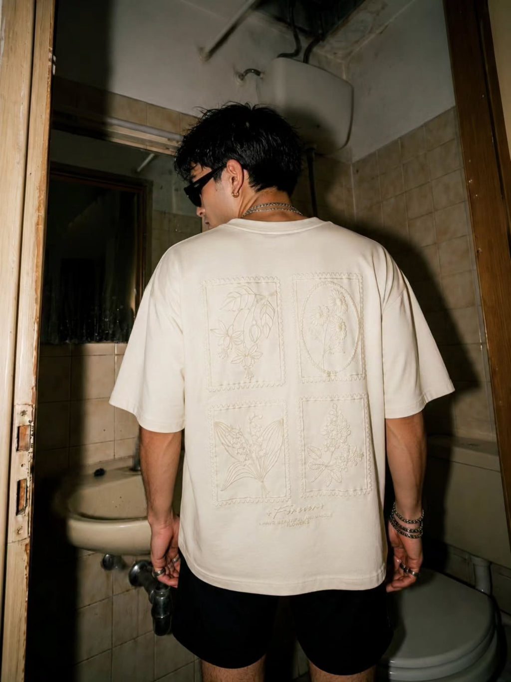 off-white / cream short-sleeved t-shirt with a subtle