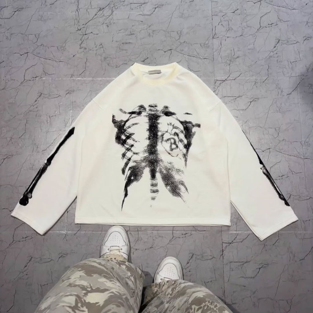 long-sleeve crewneck top with a bold x-ray-style skeleton print