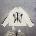 long-sleeve crewneck top with a bold x-ray-style skeleton print