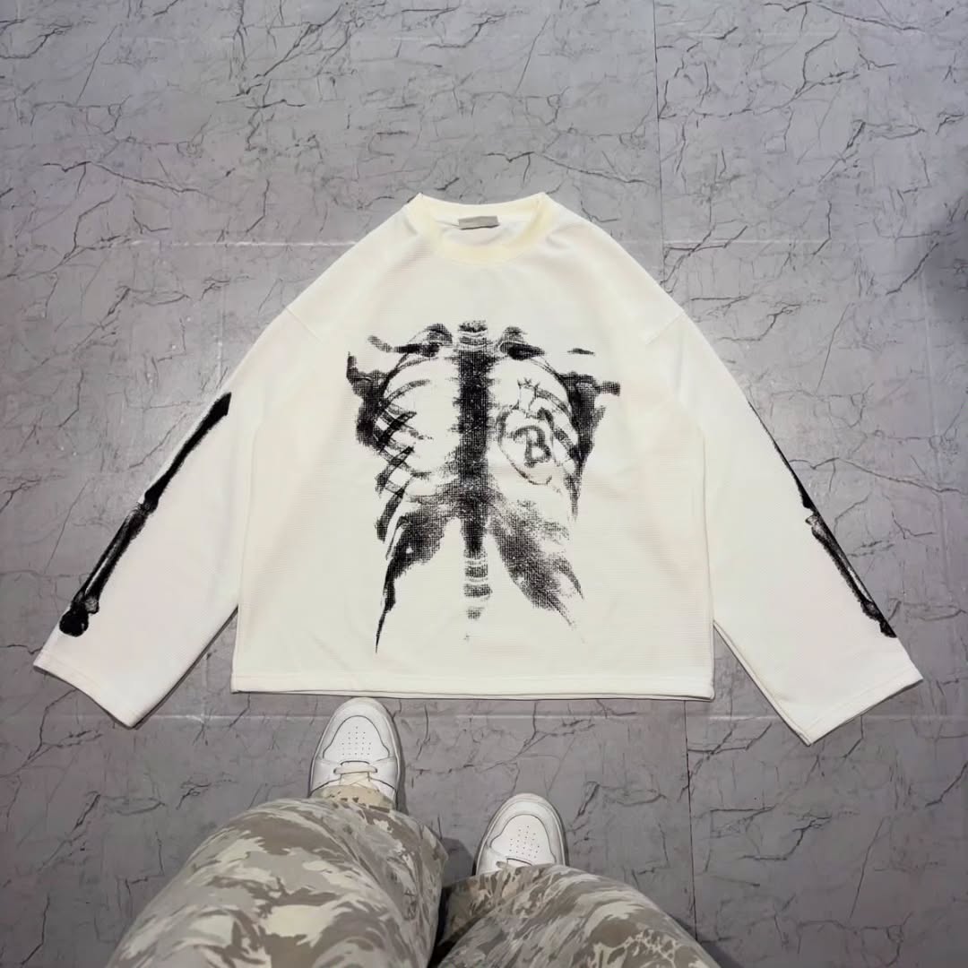 long-sleeve crewneck top with a bold x-ray-style skeleton print