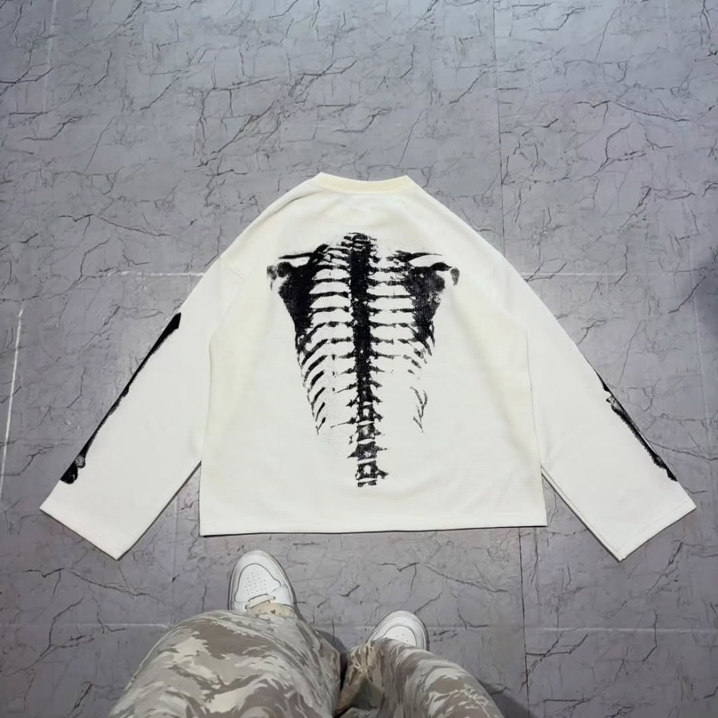 long-sleeve crewneck top with a bold x-ray-style skeleton print