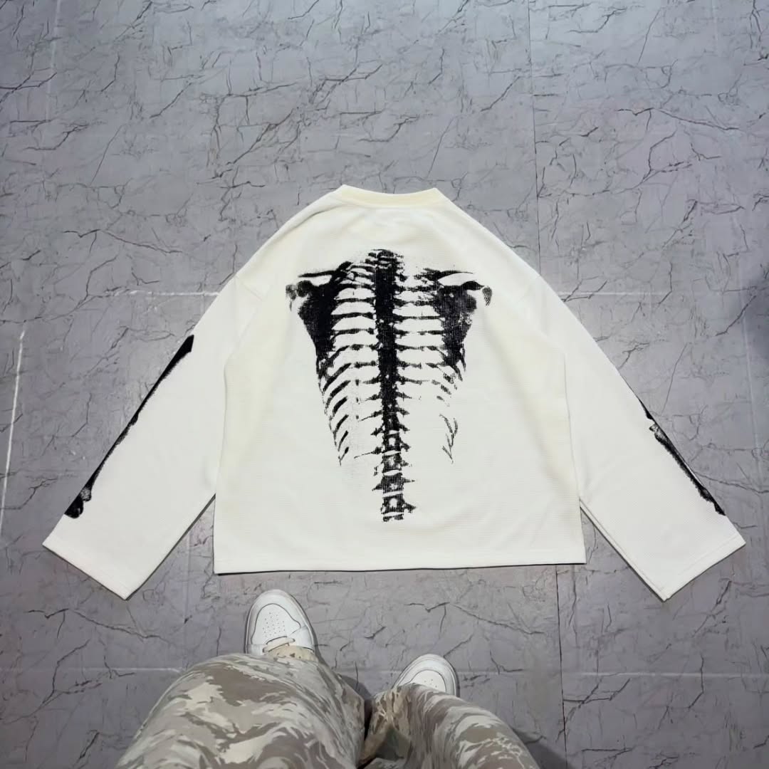 long-sleeve crewneck top with a bold x-ray-style skeleton print