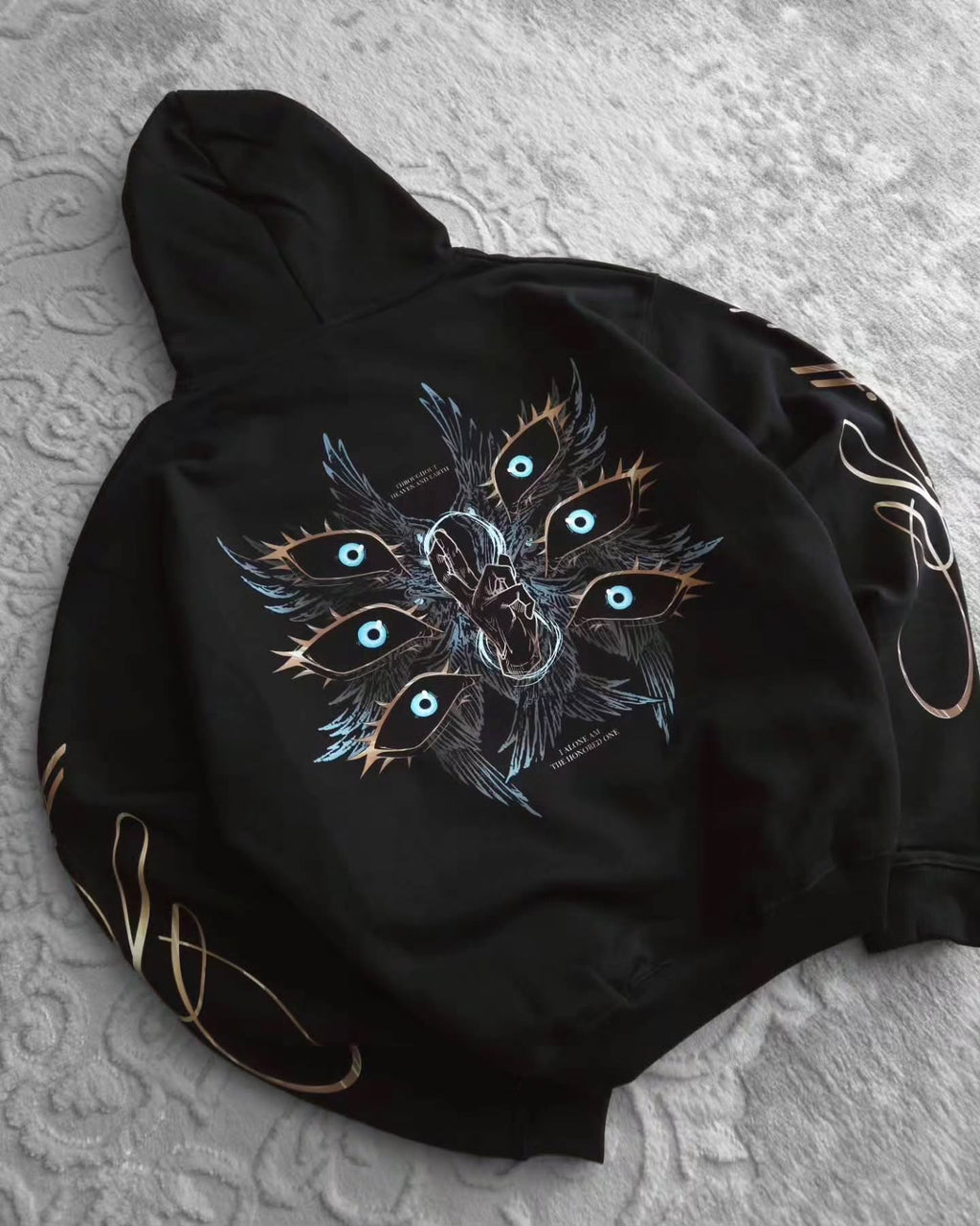 black pullover hoodie featuring an anime-inspired graphic design with dark fantasy