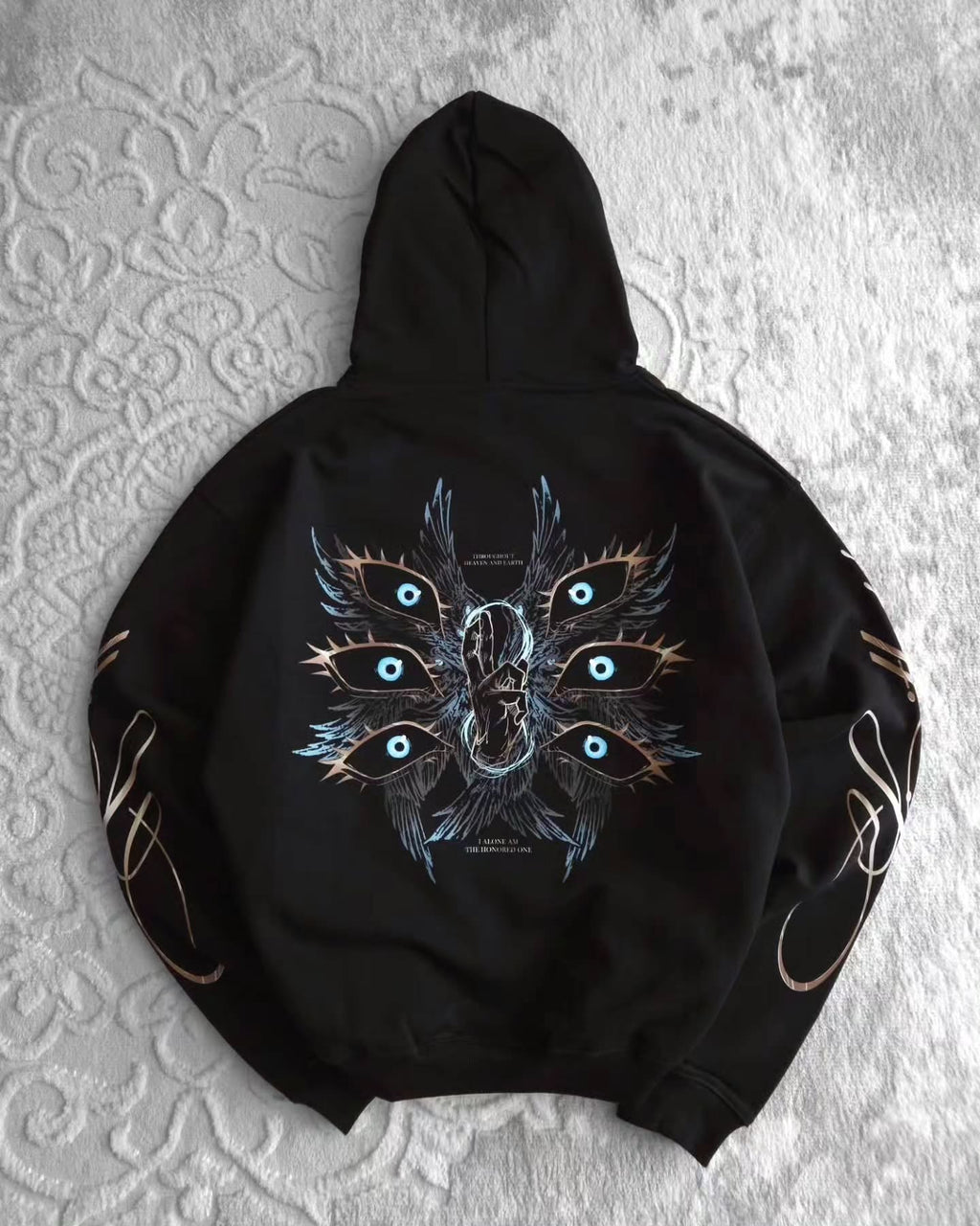 black pullover hoodie featuring an anime-inspired graphic design with dark fantasy