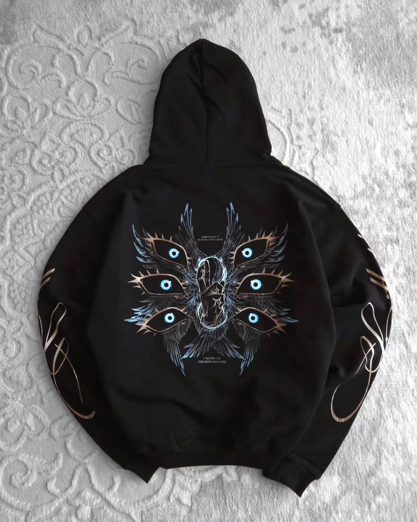 black pullover hoodie featuring an anime-inspired graphic design with dark fantasy