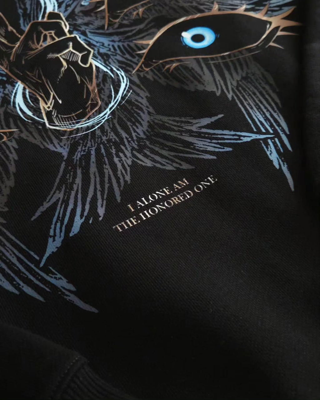 black pullover hoodie featuring an anime-inspired graphic design with dark fantasy