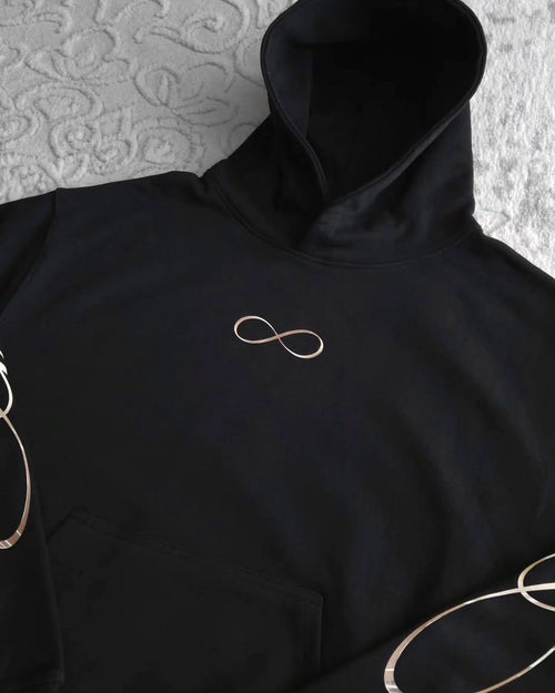 black pullover hoodie featuring an anime-inspired graphic design with dark fantasy
