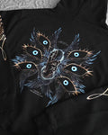 black pullover hoodie featuring an anime-inspired graphic design with dark fantasy