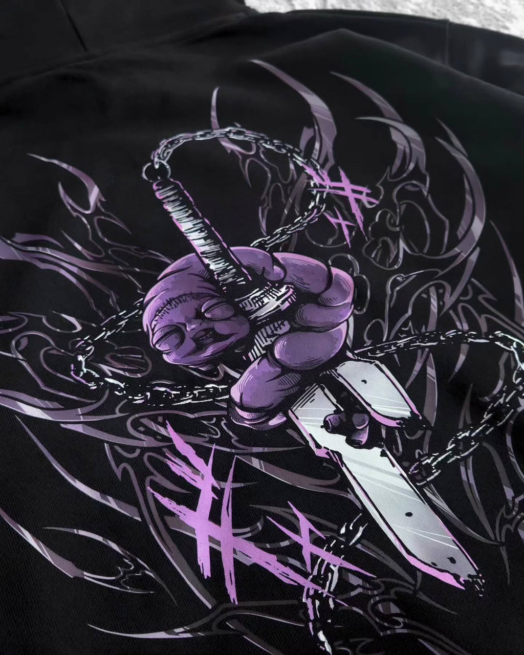 black pullover hoodie featuring an anime-inspired