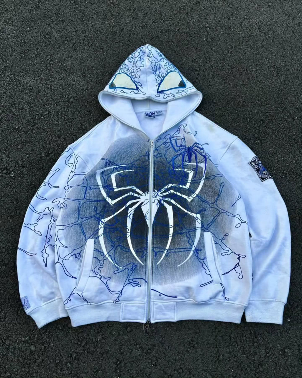 bright white full-zip hoodie themed heavily around Spider-Man