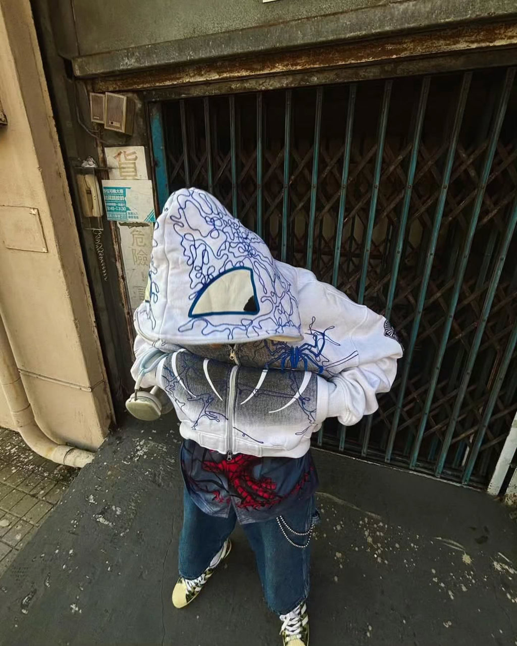 bright white full-zip hoodie themed heavily around Spider-Man