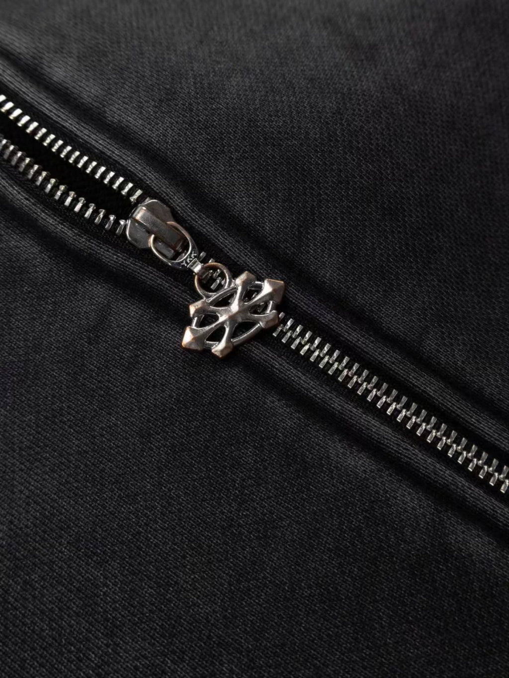 faded washed-black full-zip hoodie featuring heavy raw-edge applique patches and contrast embroidery