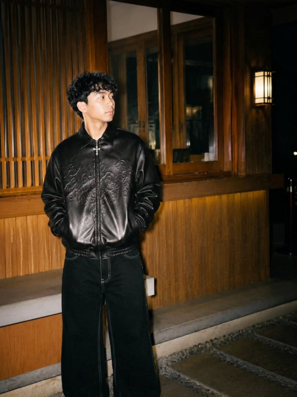monochrome darkwear outfit featuring a statement embossed leather bomber jacket