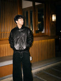 monochrome darkwear outfit featuring a statement embossed leather bomber jacket
