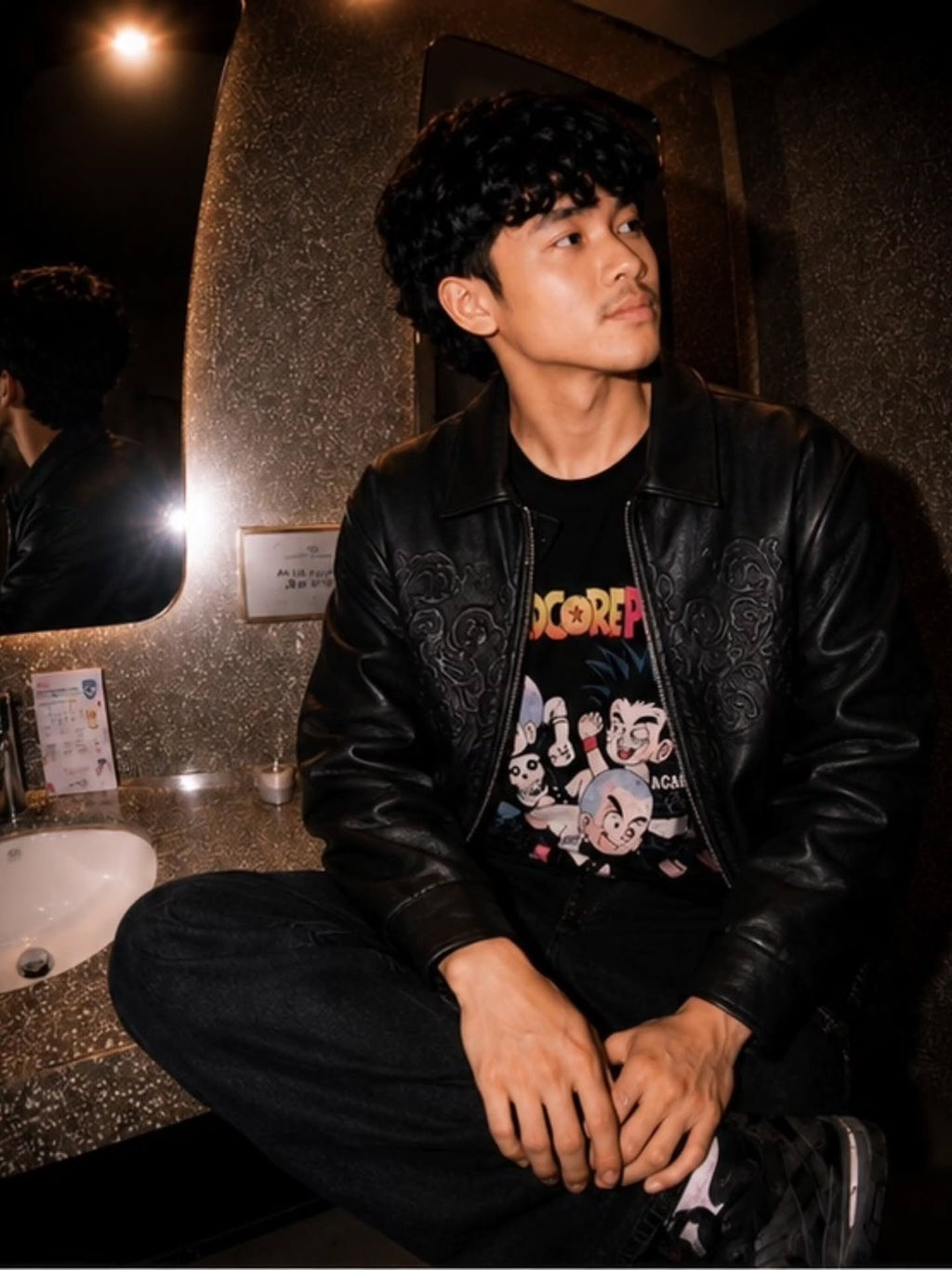 monochrome darkwear outfit featuring a statement embossed leather bomber jacket