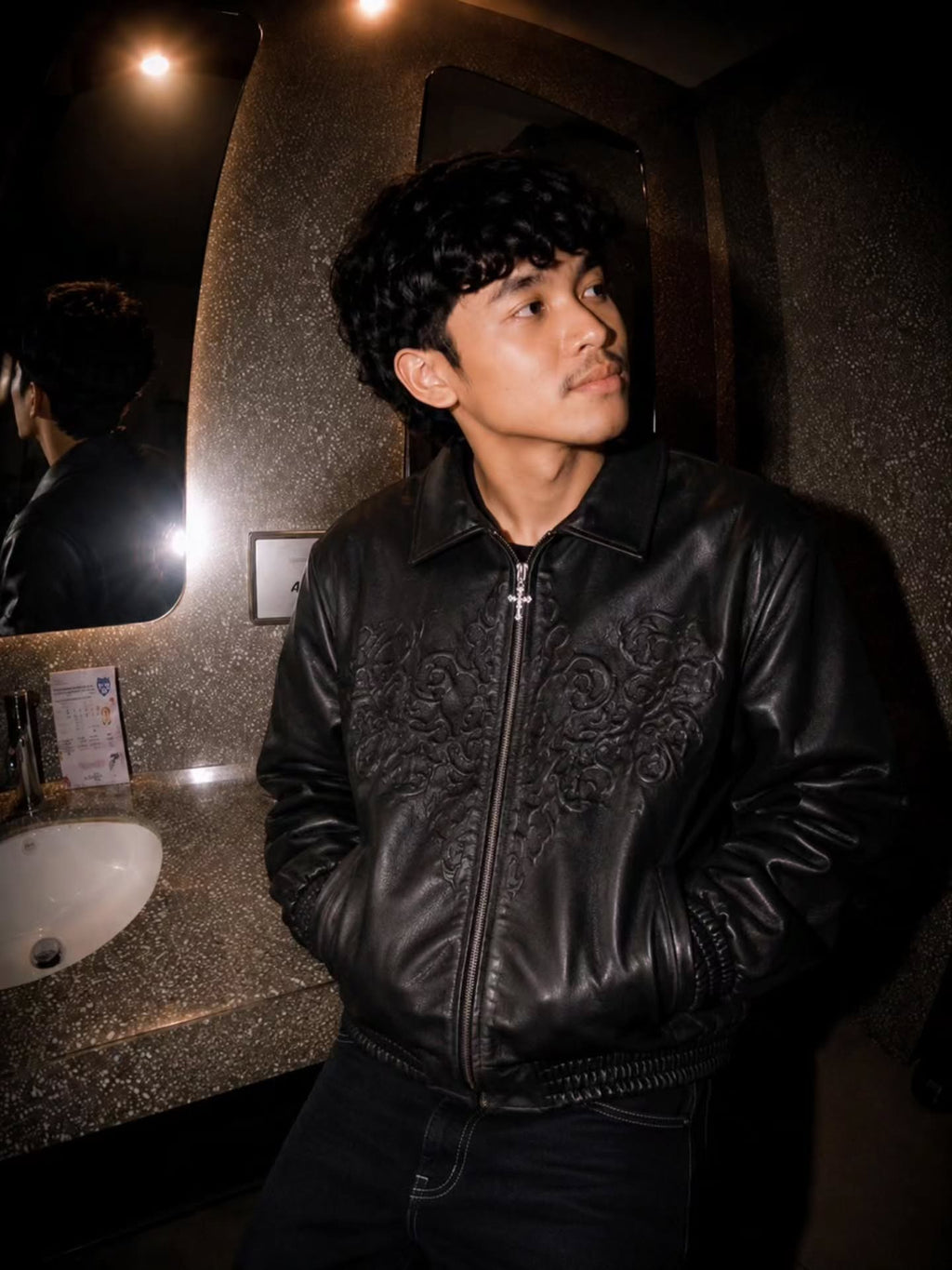 monochrome darkwear outfit featuring a statement embossed leather bomber jacket
