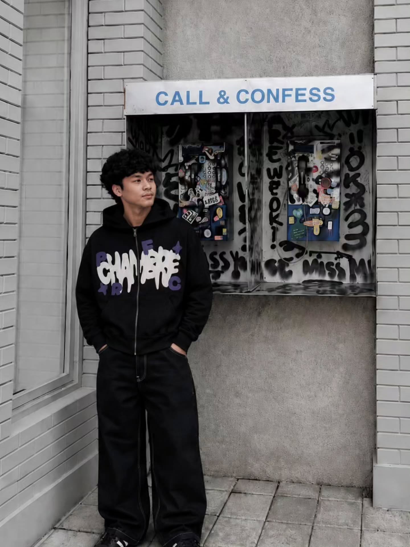 black full-zip hoodie featuring bold, 3D foam-printed