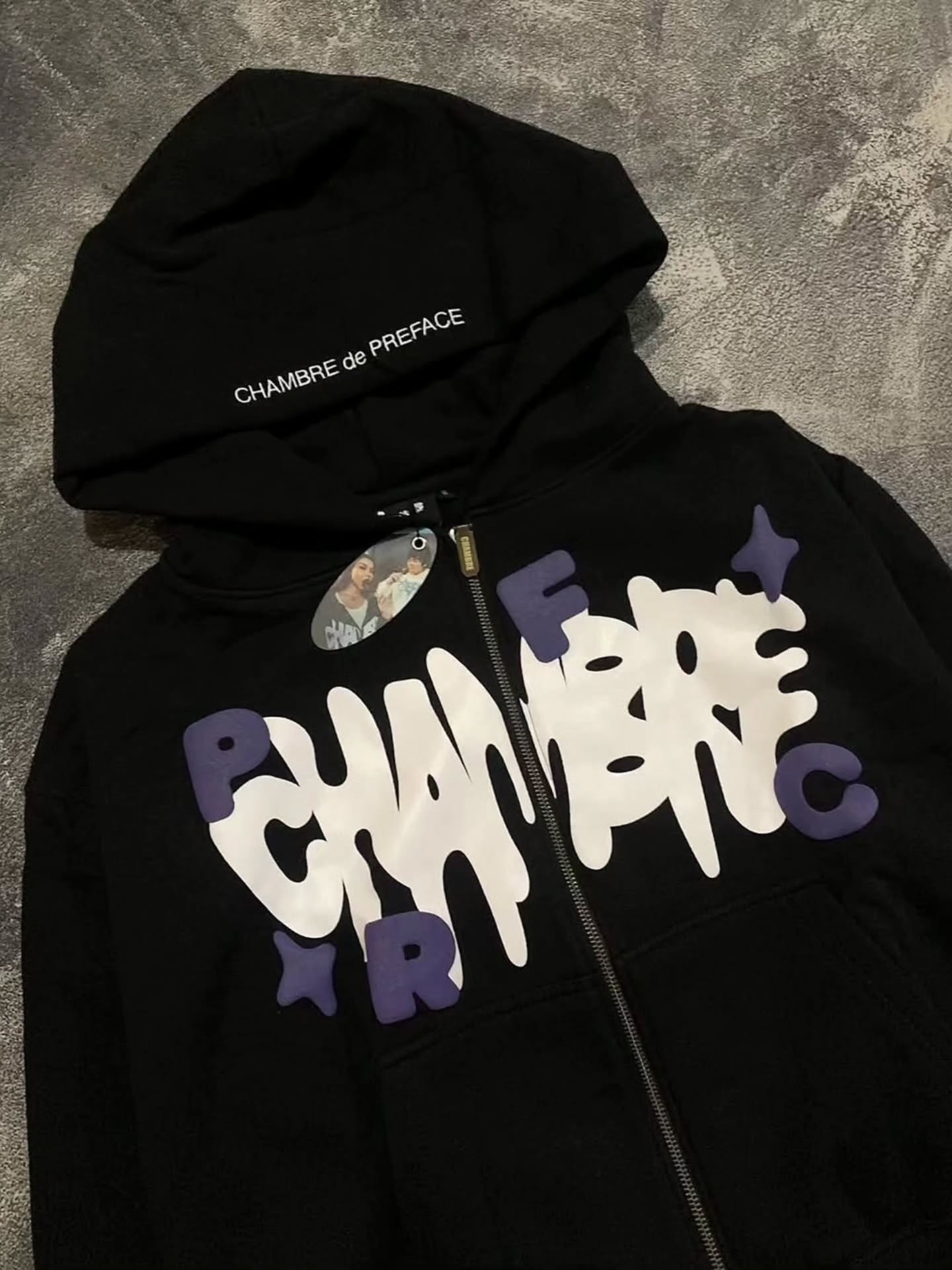 black full-zip hoodie featuring bold, 3D foam-printed