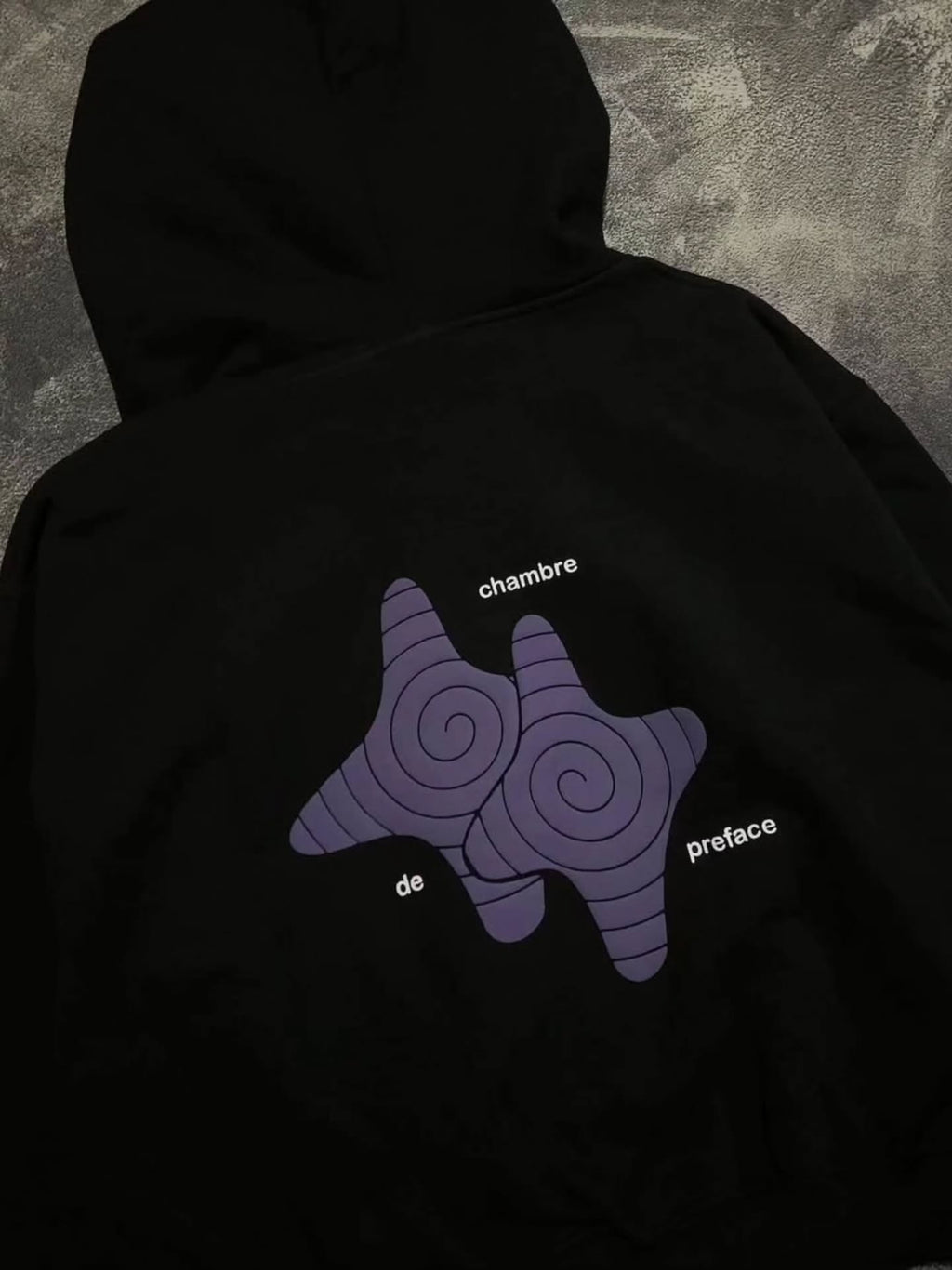black full-zip hoodie featuring bold, 3D foam-printed
