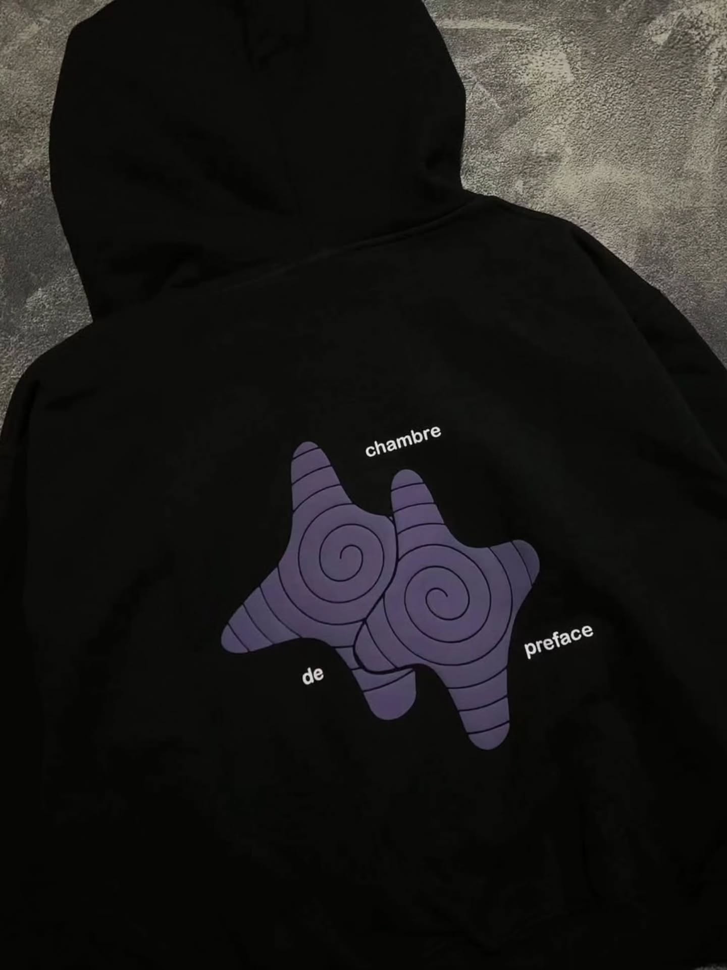 black full-zip hoodie featuring bold, 3D foam-printed